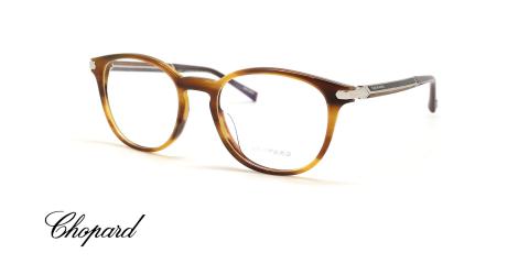 عینک طبی شوپارد فریم کائوچویی حدقه گرد قهوه ای هاوانا دسته ها کربن و چوب - عکس از زاویه سه رخ