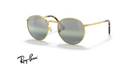 عینک آفتابی ری بن مدل گرد طرح جدید فریم فلزی طلایی براق و عدسی نقره ای آبی جیوه ای پلاریزه - عکس از زاویه سه رخ