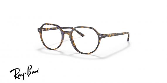 عینک طبی ری بن مدل فریم جنس استات چند ضلعی رنگ قهوه ای و آبی هاوانا - عکس از زاویه سه رخ