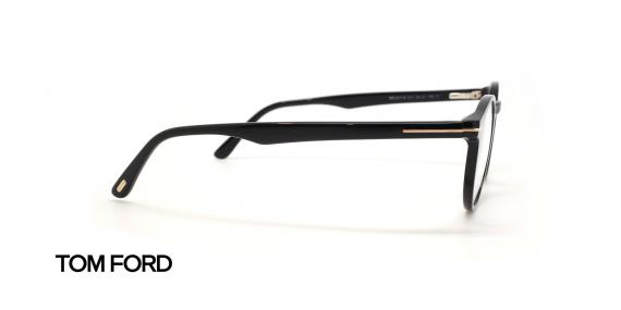 عینک طبی کائوچویی تام فورد فریم گرد رنگ مشکی عدسی بلوگنترل - عکس از زاویه کنار