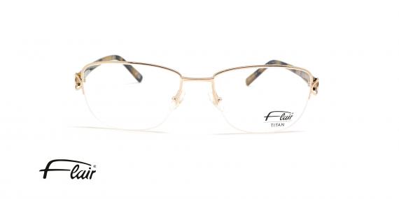 عینک طبی تیتانیومی فلر فریم زیر گریف طلایی و خدقه های بیضی شکل - عکس از زاویه روبرو