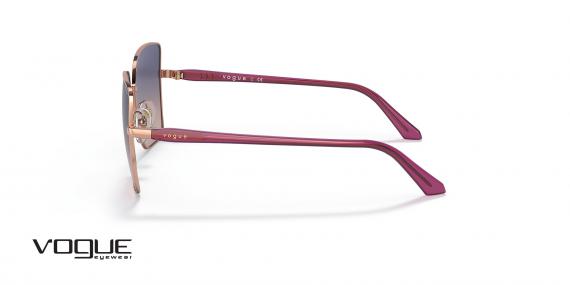 عینک آفتابی زنانه وگ فریم پروانه ای به رنگ رزگلد و عدسی بنفش و صورتی طیف دار - عکس از زاویه کنار