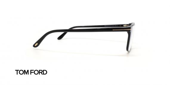 عینک طبی تام فورد فریم کائوچویی مستطیلی مشکی با نمادT رد محل اتصال دسته به حدقه - عکس از زاویه کنار
