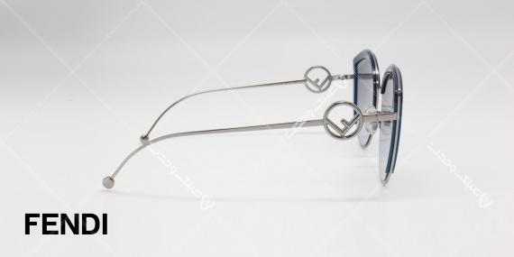 عینک آفتابی فندی طرح قطره آب - بدنه نقره ای - عدسی های دودی طیف دار - عکاسی وحدت - زاویه کنار