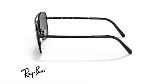 عینک آفتابی ری بن مدل کاروان طرح جدید فریم فلزی مشکی و عدسی خاکستری - عکس از زاویه کنار