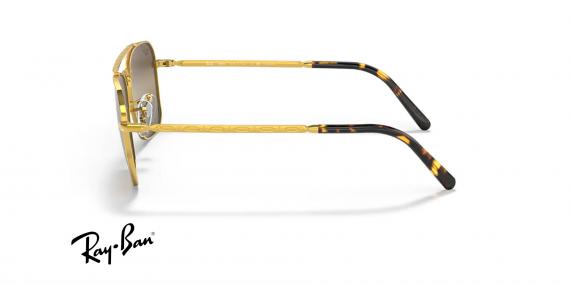 عینک آفتابی ری بن مدل کاروان طرح جدید فریم فلزی طلایی براق و عدسی قهوه ای نقره ای کرومانس و پلاریزه - عکس از زاویه کنار