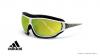 عینک آفتابی آدیداس - مدل Tycane Pro Outdoor - رنگ سفید - عدسی های سبز جیوه ای -عکاسی وحدت - زاویه سه رخ
